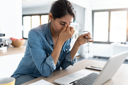 how do you handle stress: Tired woman rubbing the bridge of her nose