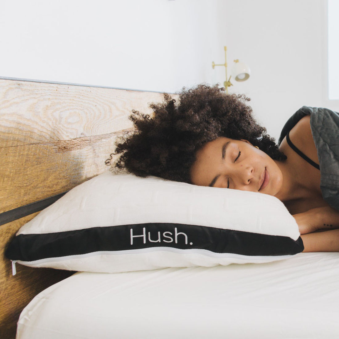 A woman sleeps soundly on the Hush mattress.