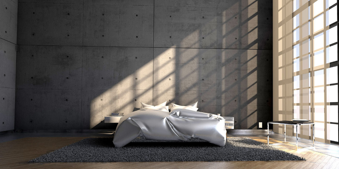 industrial designed bedroom with concrete wall and full-length windows