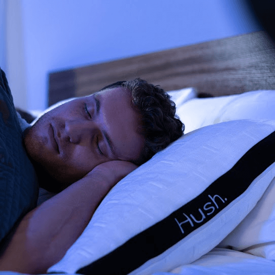 how to fall asleep in 10 seconds: Man sleeping with a weighted blanket