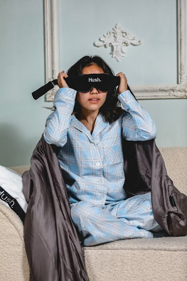 Woman wearing a Hush sleep mask