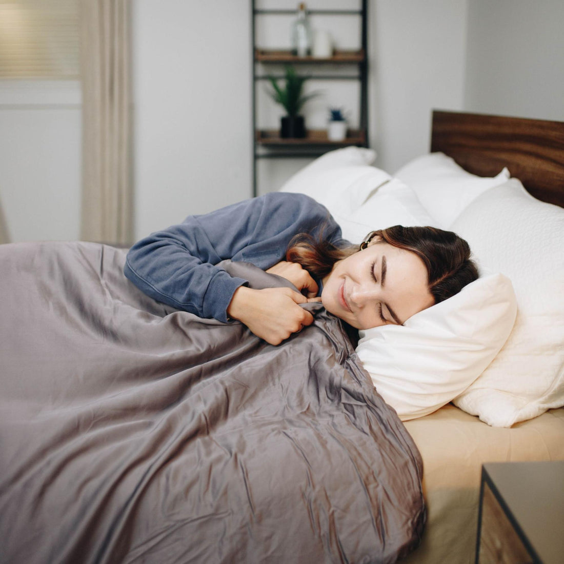 sensory overload anxiety: woman happily sleeping